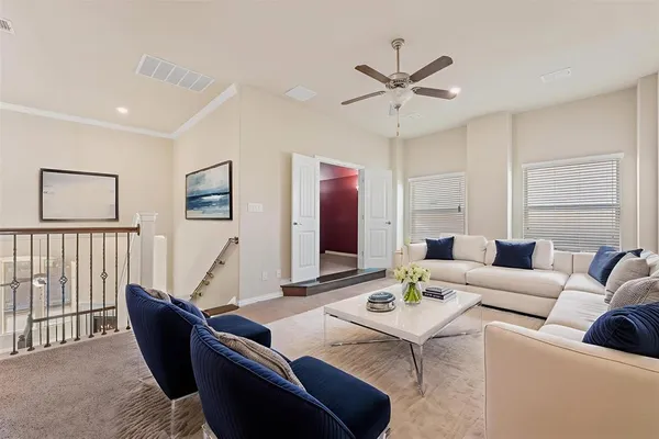 a living room with furniture and white walls