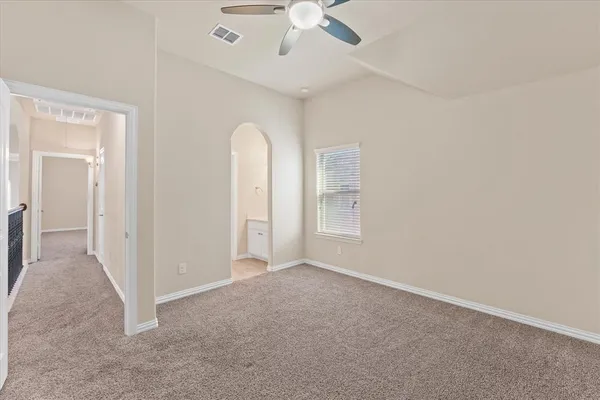a view of room with window and ceiling fan