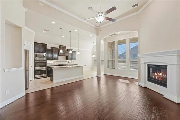 a view of kitchen with granite countertop appliances with a fireplace