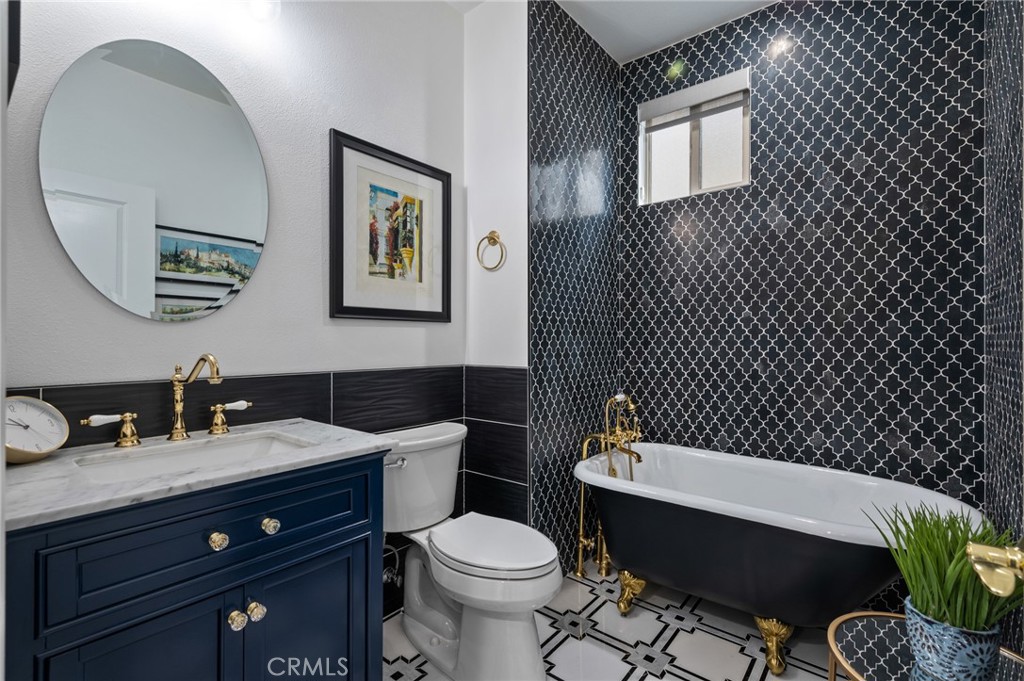 5441 Ocean, Unit 101 Hawthorne, CA 90250 - Photo 12 of 37 a bathroom with a toilet a sink and mirror