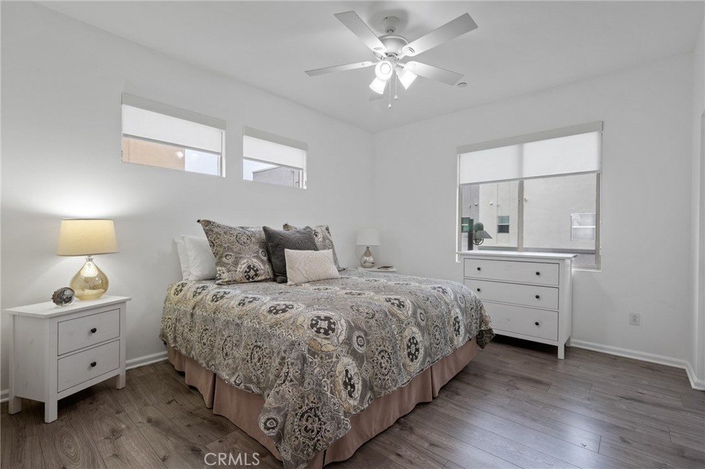 5441 Ocean, Unit 101 Hawthorne, CA 90250 - Photo 13 of 37 a bedroom with a large bed and a chandelier