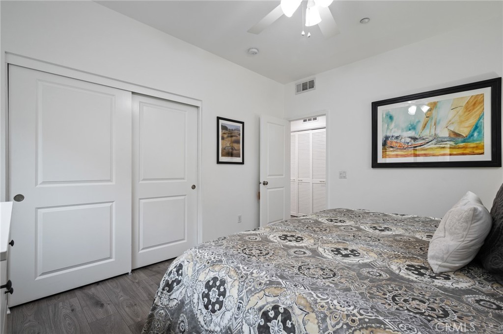 5441 Ocean, Unit 101 Hawthorne, CA 90250 - Photo 14 of 37 a bedroom with a bed and a painting on the wall