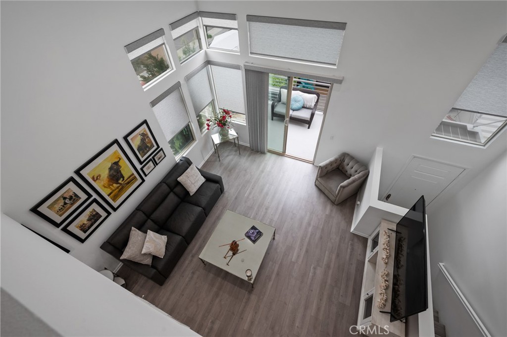 5441 Ocean, Unit 101 Hawthorne, CA 90250 - Photo 15 of 37 a living room with furniture and a wooden floor