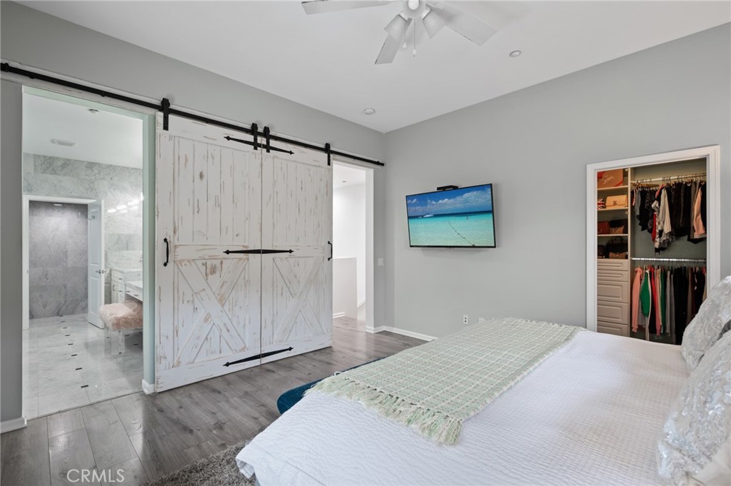 5441 Ocean, Unit 101 Hawthorne, CA 90250 - Photo 18 of 37 a bedroom with a bed and a chandelier