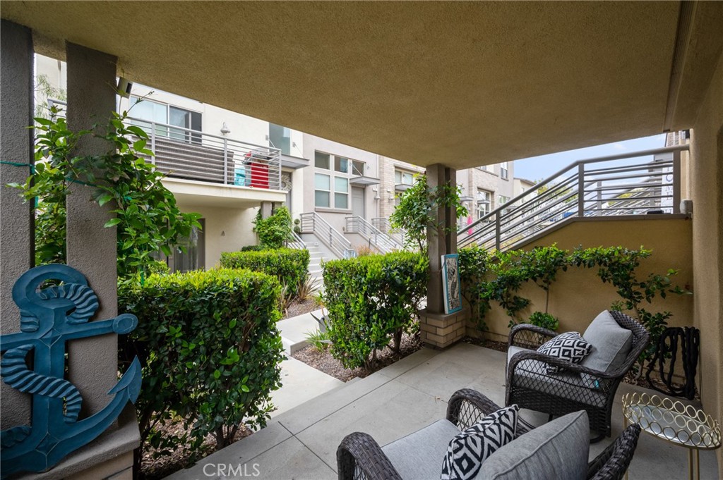 5441 Ocean, Unit 101 Hawthorne, CA 90250 - Photo 22 of 37 a view of a patio with couches table and chairs and potted plants