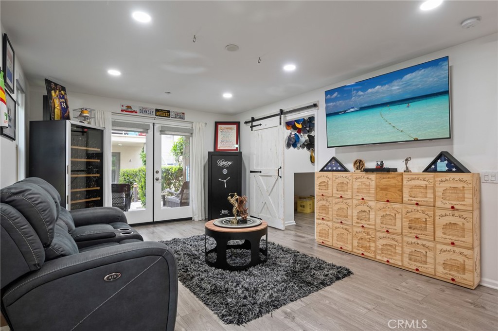 5441 Ocean, Unit 101 Hawthorne, CA 90250 - Photo 23 of 37 a living room with furniture and a flat screen tv