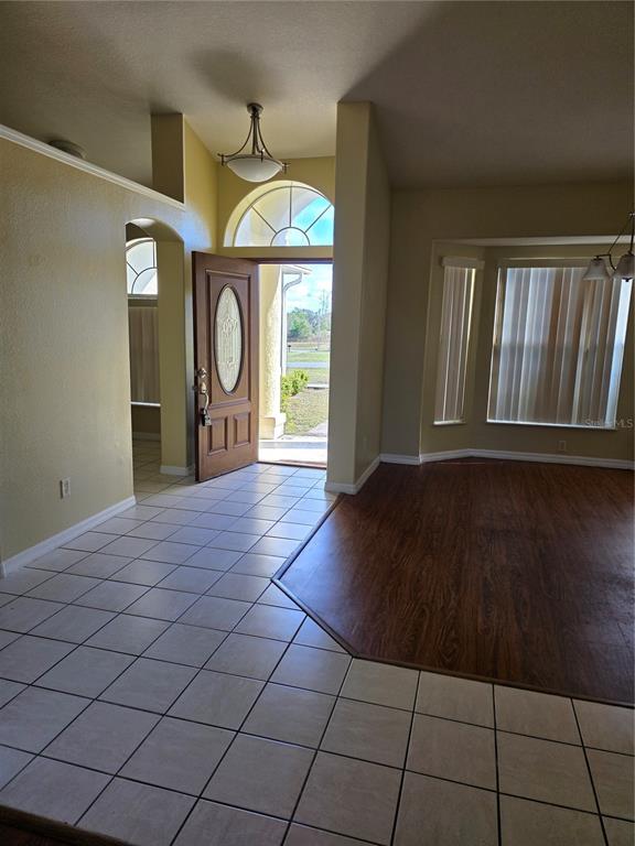4692 Southwest 158th St Road, Unit 5 Ocala, FL 34473 - Photo 3 of 4 a view of a room with wooden floor and a window