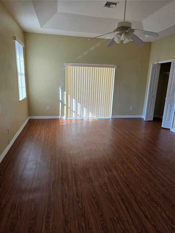 4692 Southwest 158th St Road, Unit 5 Ocala, FL 34473 - Photo 4 of 4 wooden floor in an empty room with a window