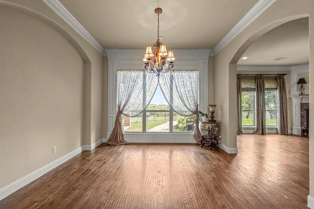 a kitchen with stainless steel appliances granite countertop a stove and a refrigerator