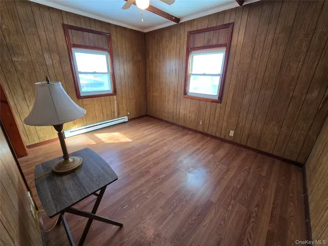 a view of a livingroom with furniture and windows