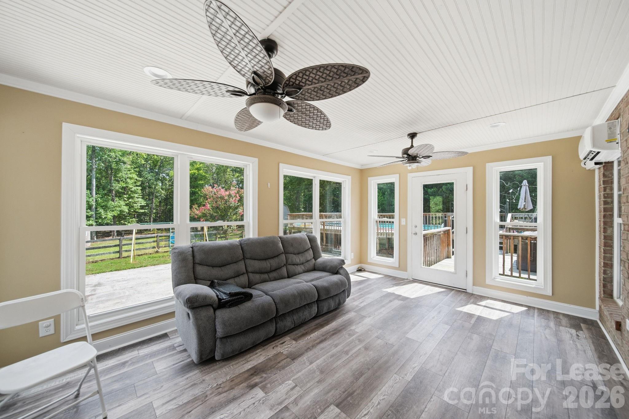 7107 Nesbit Road Waxhaw, NC 28173 - Photo 33 of 42 a living room with furniture and windows