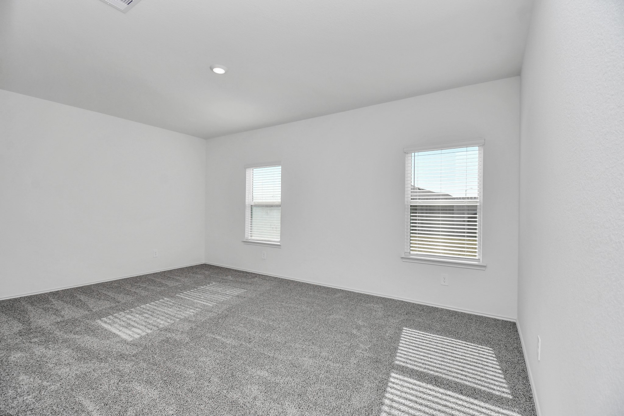 30903 Rockstock Road Fulshear, TX 77441 - Photo 20 of 42 a view of an empty room with a window