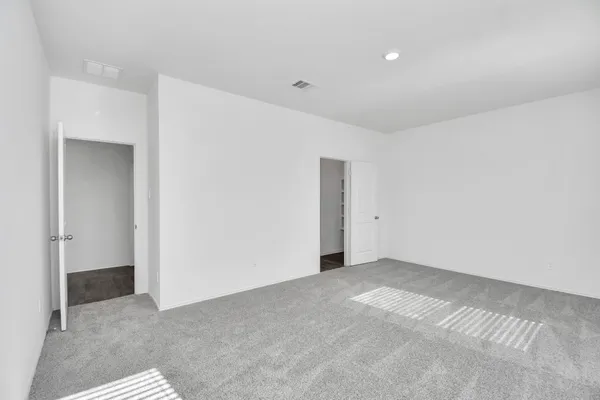 a bathroom with a double vanity sink a mirror and a shower