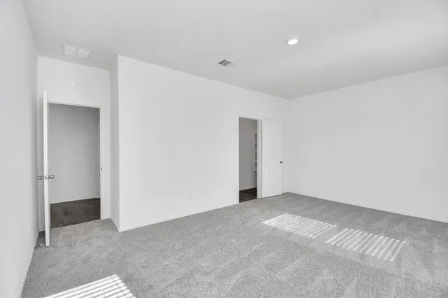 a bathroom with a double vanity sink a mirror and a shower