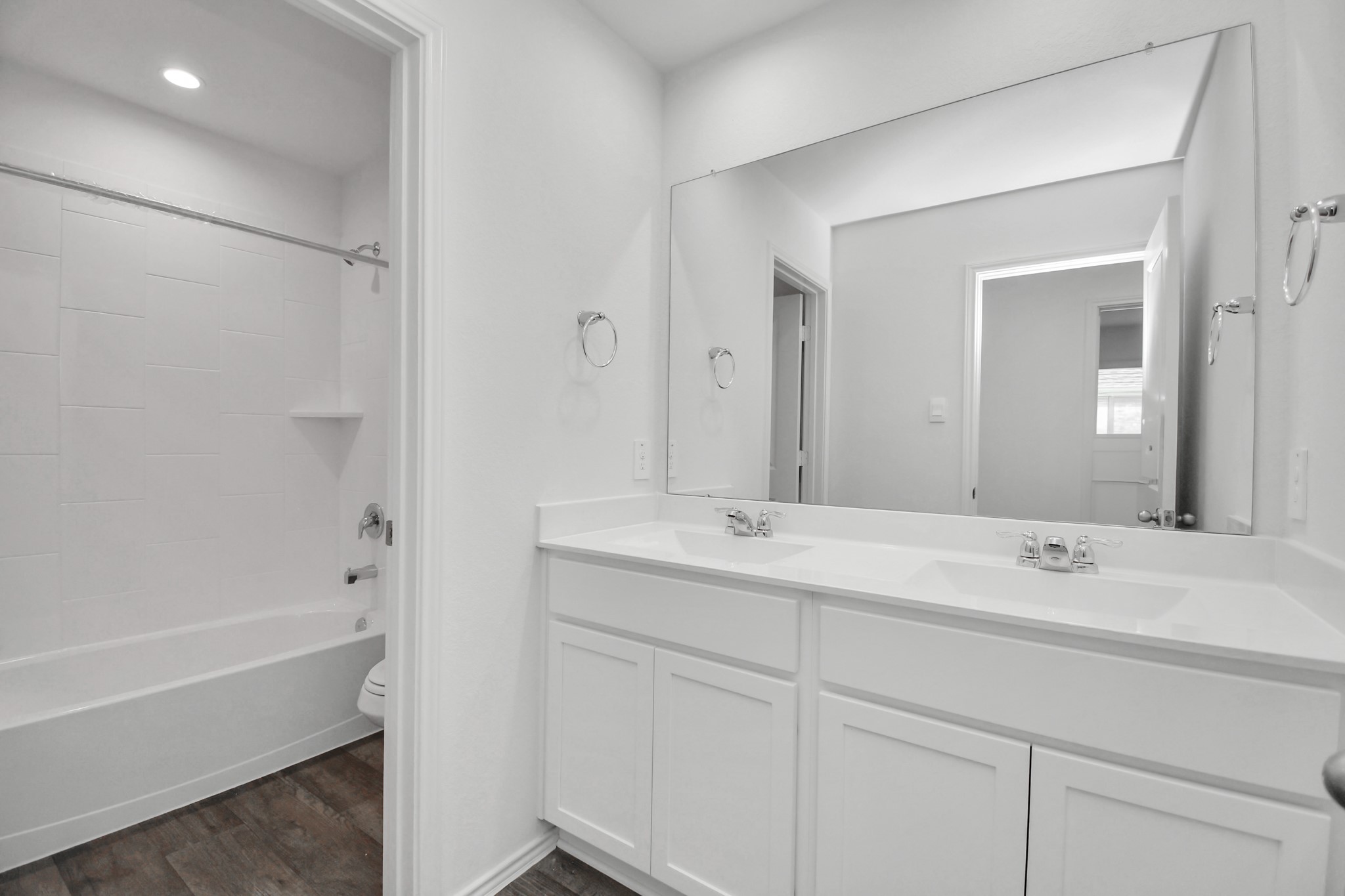 30903 Rockstock Road Fulshear, TX 77441 - Photo 29 of 42 a bathroom with a tub sink and mirror