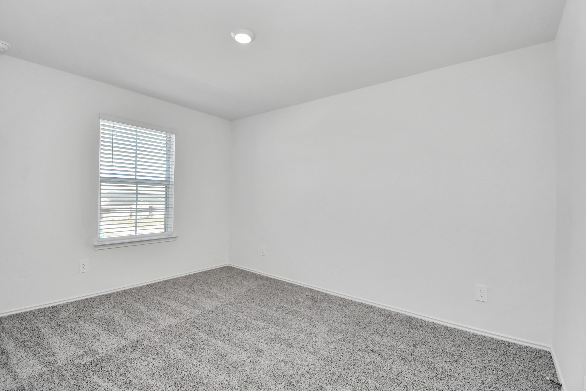 30903 Rockstock Road Fulshear, TX 77441 - Photo 30 of 42 an empty room with a window