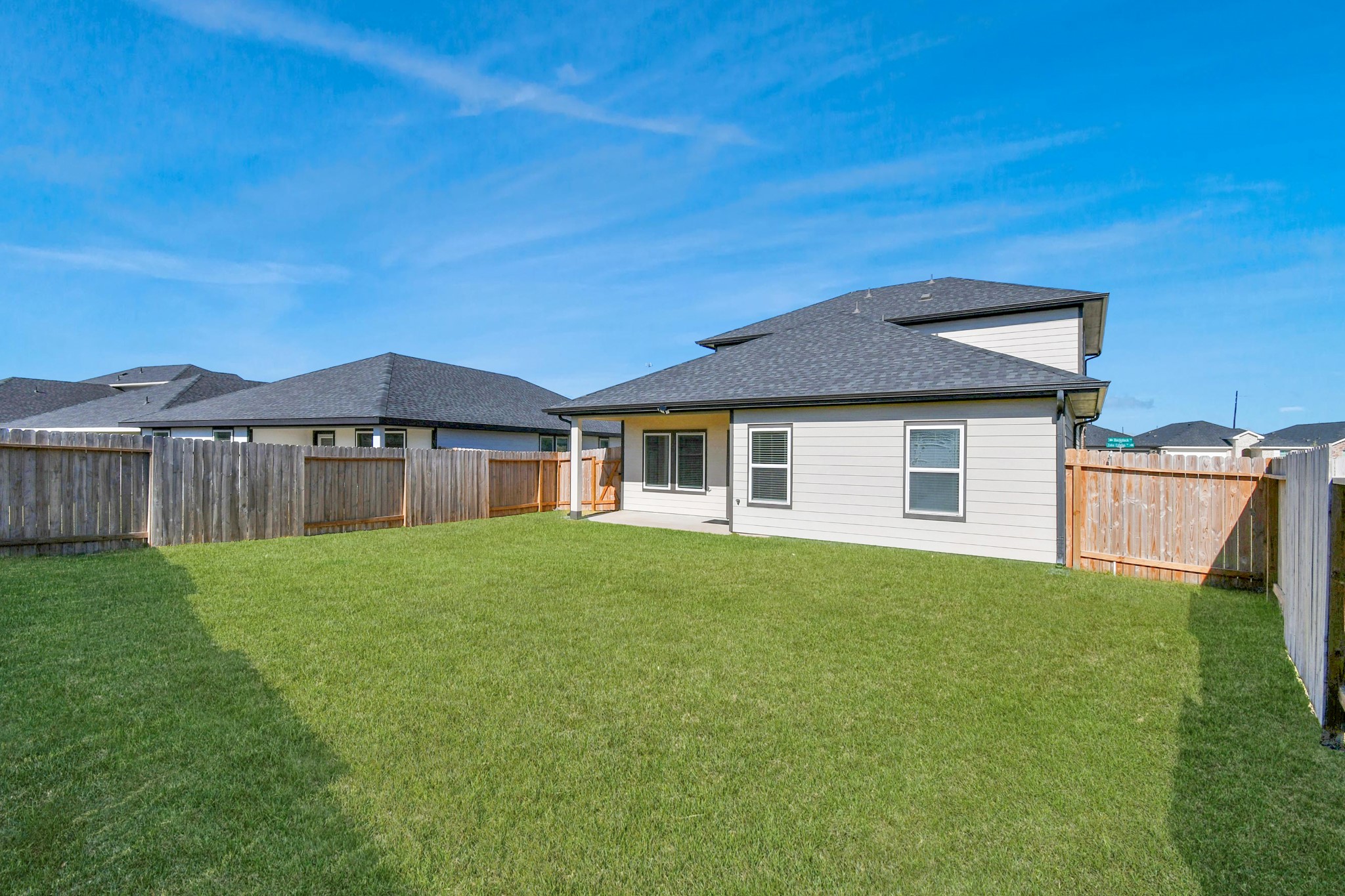 30903 Rockstock Road Fulshear, TX 77441 - Photo 4 of 42 a front view of a house with yard and green space