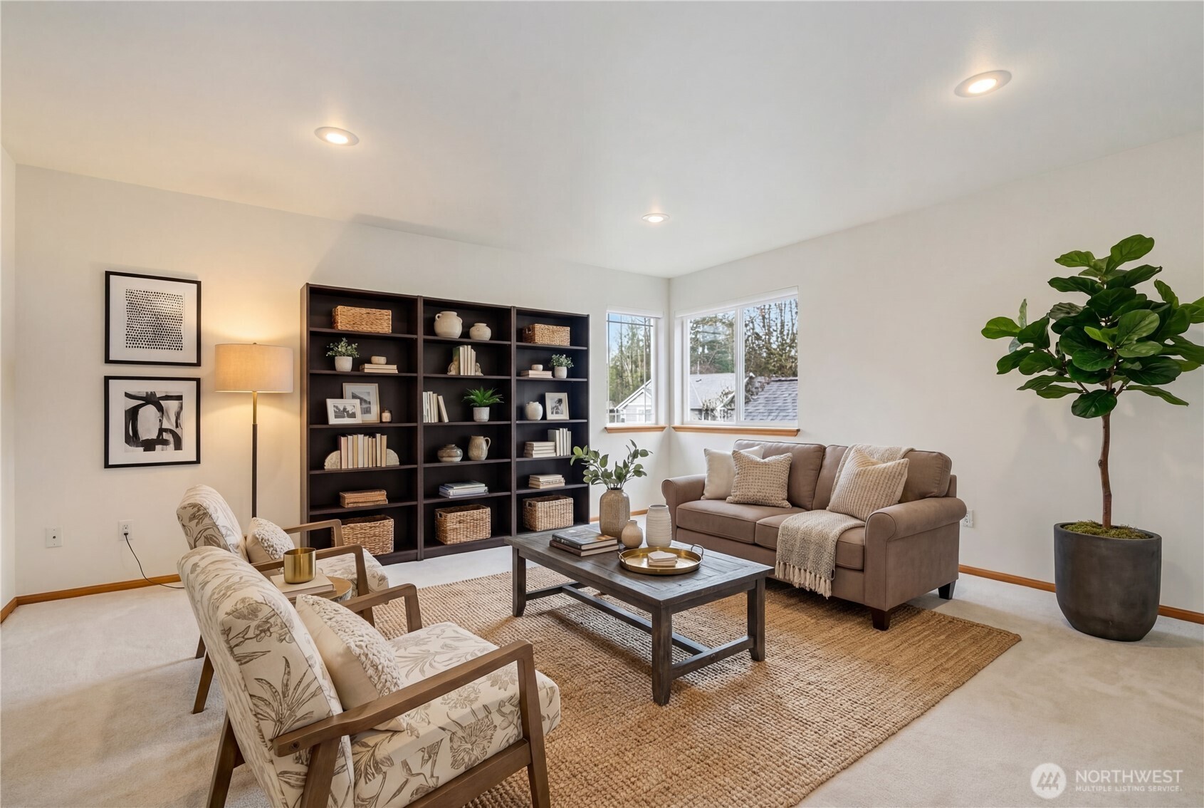 18639 175th Avenue Southeast Renton, WA 98058 - Photo 31 of 37 a living room with furniture a table and a potted plant