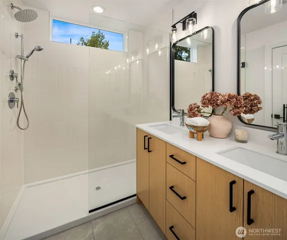 a bathroom with a sink and mirror
