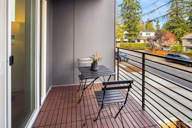 a balcony view with a seating space