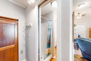 a view of a bathroom from a hallway