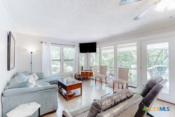 510 Cypress Ridge Road McQueeney, TX 78123 - Photo 9 of 32 a living room with furniture and a large window