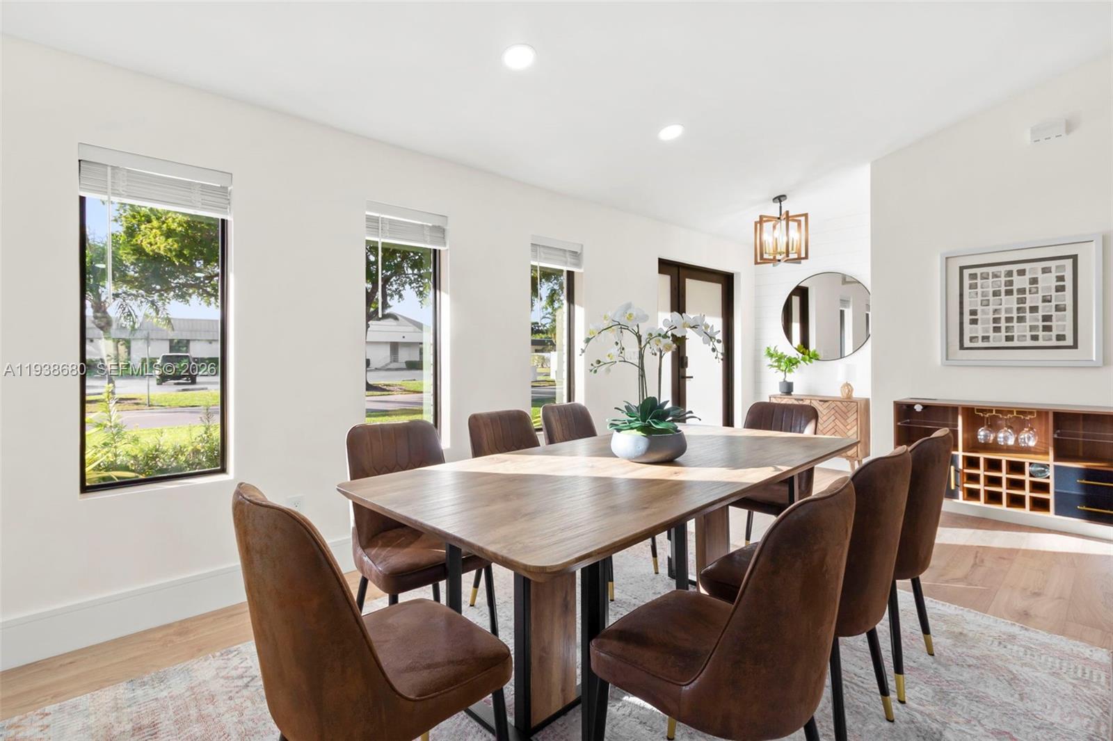 3540 Northeast 28th Avenue Lighthouse Point, FL 33064 - Photo 12 of 47 a view of a dining room with furniture window and wooden floor