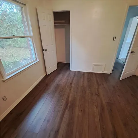 a view of front door with wooden floor