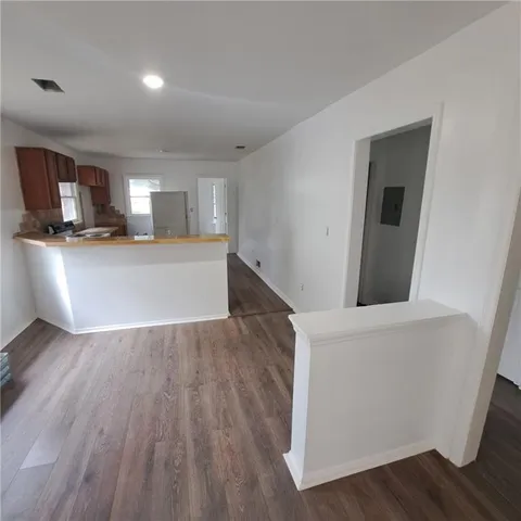 a view of kitchen and wooden floor