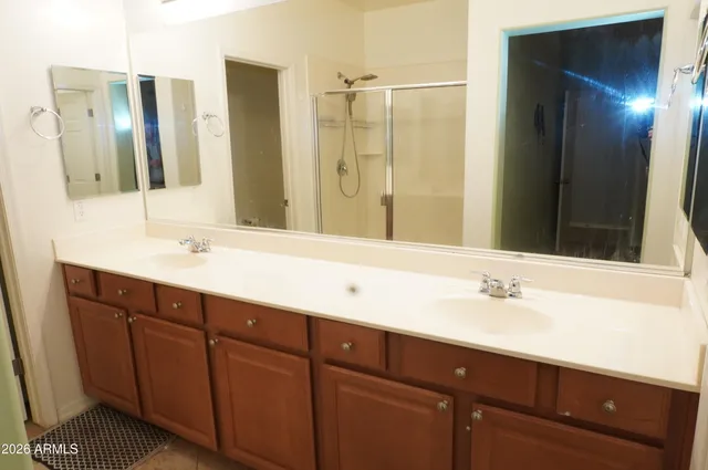 a bathroom with a sink and a mirror