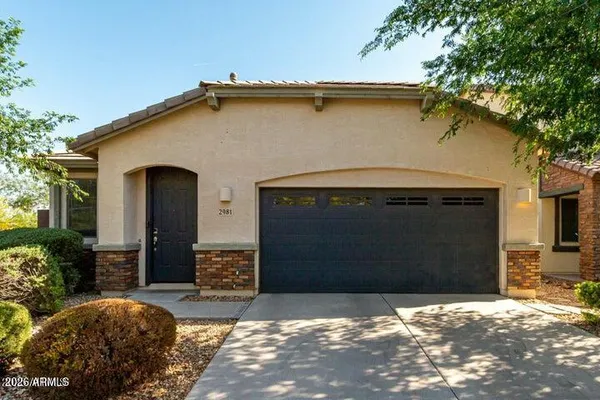 a front view of a house with a garage