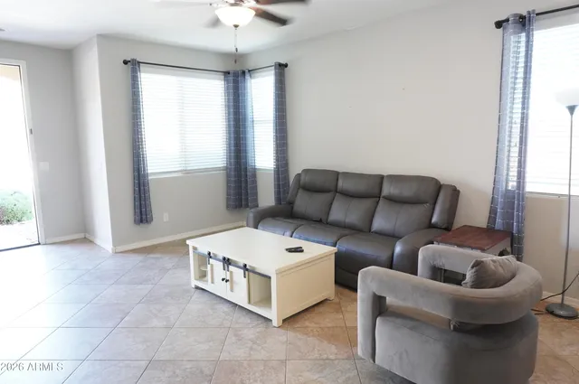 a living room with furniture and a window