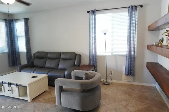 a living room with furniture and a window