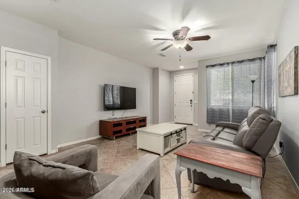 a living room with furniture and a flat screen tv