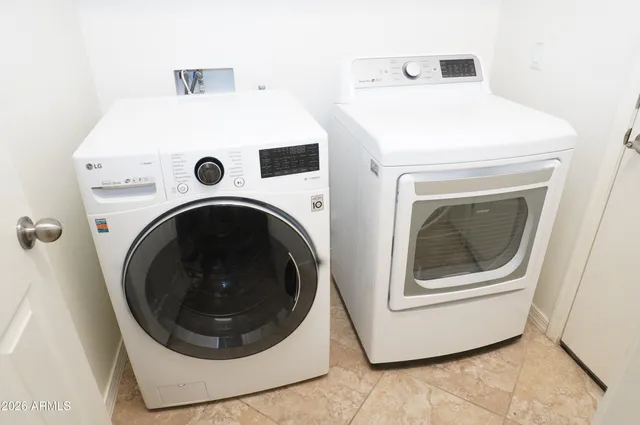 a utility room with dryer and washer