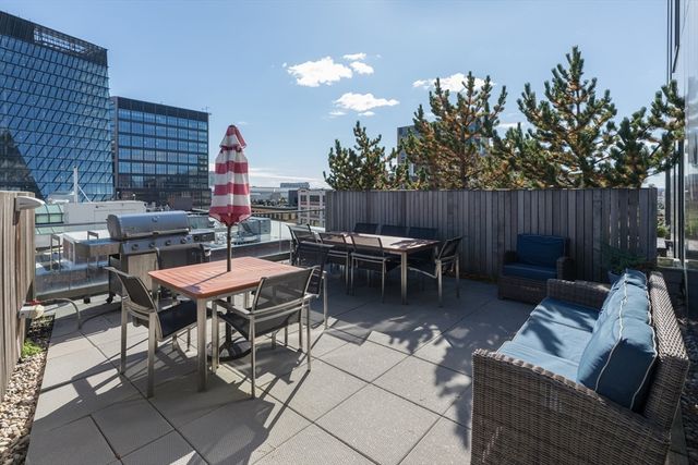 a table and chairs in front of a building