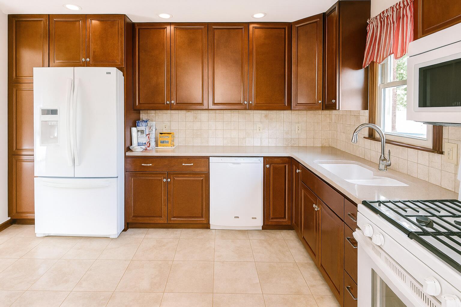 3631 Manor Drive Highland, IN 46322 - Photo 4 of 30 a kitchen with a sink a refrigerator and a stove top oven