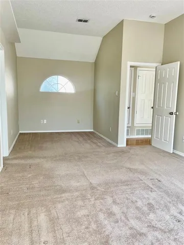 a spacious bathroom with a tub shower and sink
