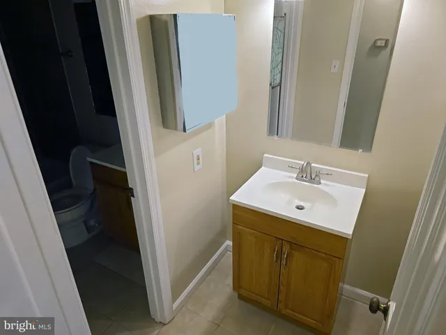 a kitchen with granite countertop a sink and a stove top oven