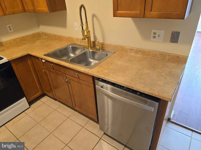 a stove top oven sitting inside of a kitchen