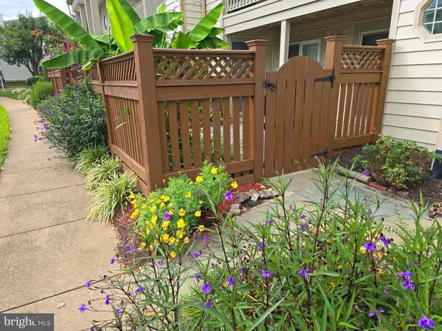 a sign that is in front of flowers