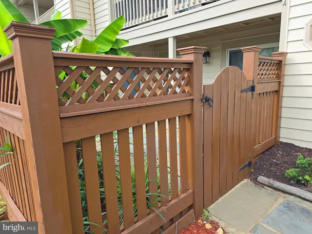 a front view of a house with a wooden fence