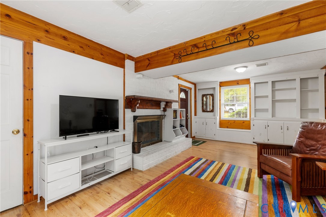 Living area featuring light wood-style flooring, a