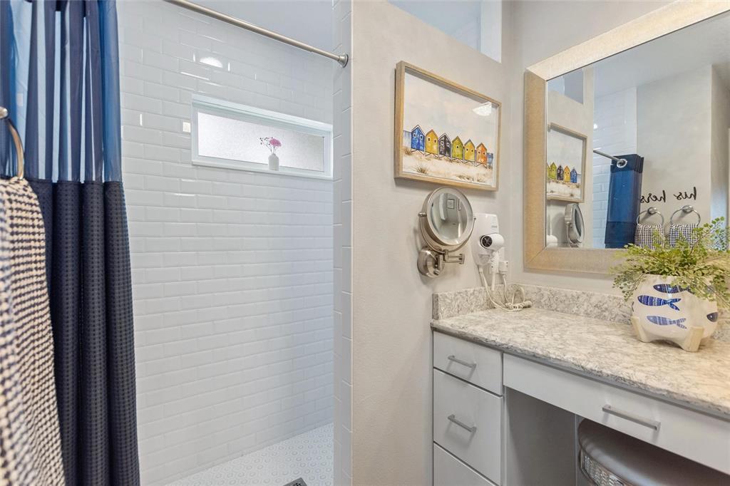 1395 South Lake Reedy Boulevard Frostproof, FL 33843 - Photo 27 of 81 a bathroom with a granite countertop sink and a mirror