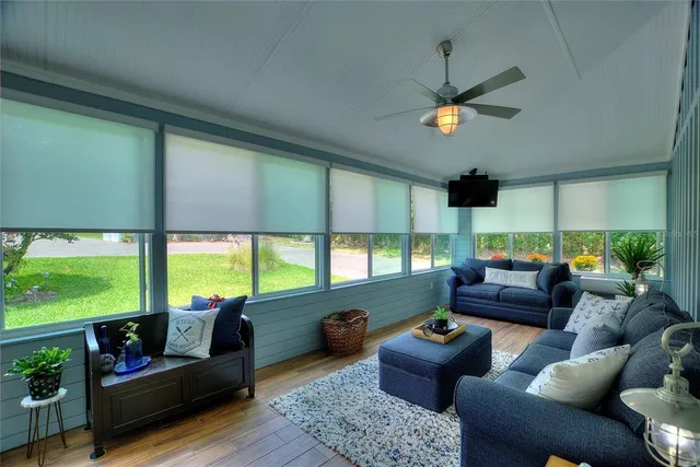 a front view of house with a garden and trees