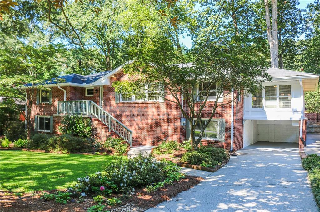 712 North Superior Avenue Decatur, GA 30033 - Photo 1 of 1 a front view of a house with garden