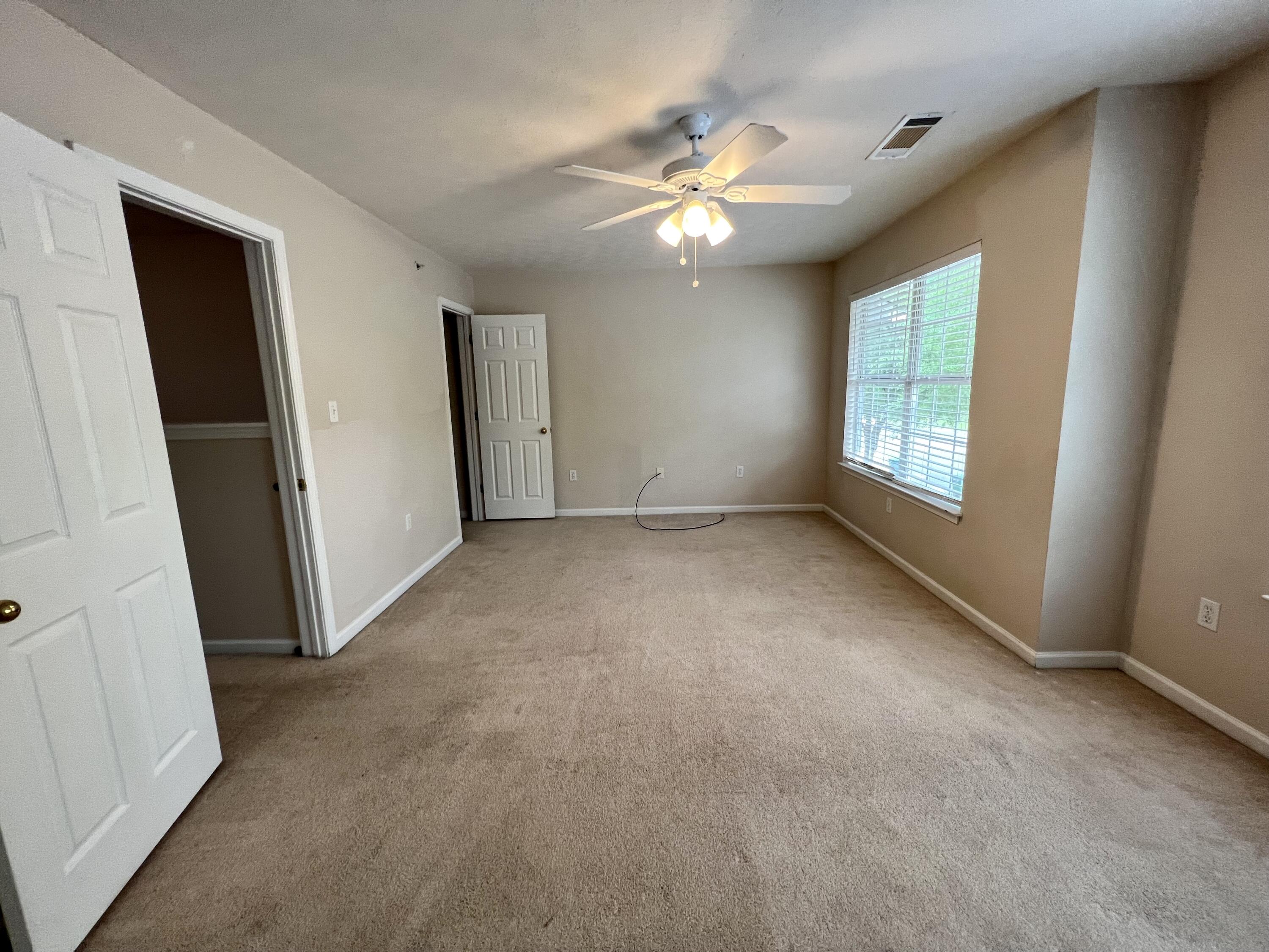 308 Crooked Pine Trail Crestview, FL 32539 - Photo 14 of 20 an empty room with windows and fan