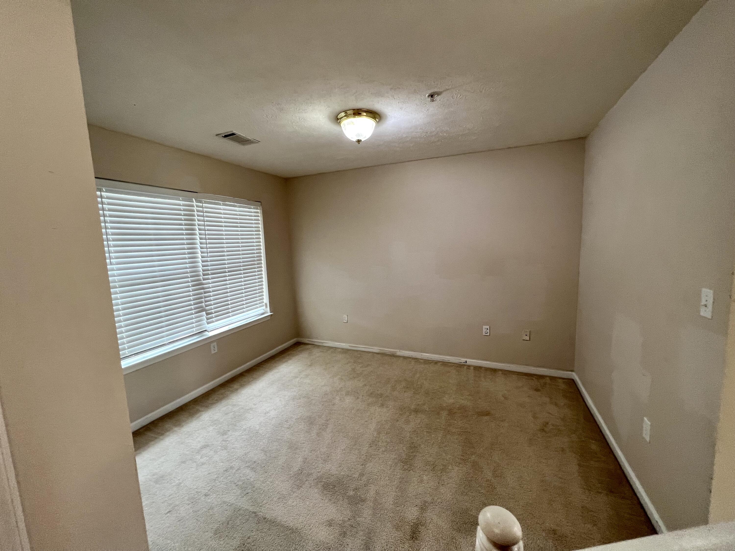 308 Crooked Pine Trail Crestview, FL 32539 - Photo 18 of 20 a view of an empty room with a window