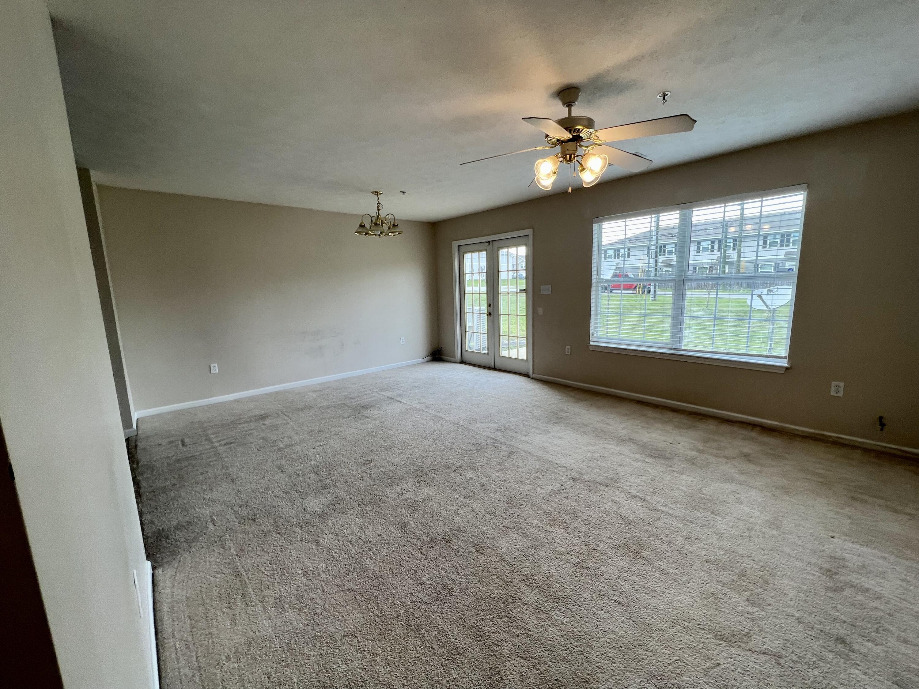 308 Crooked Pine Trail Crestview, FL 32539 - Photo 19 of 20 an empty room with windows and ceiling fan