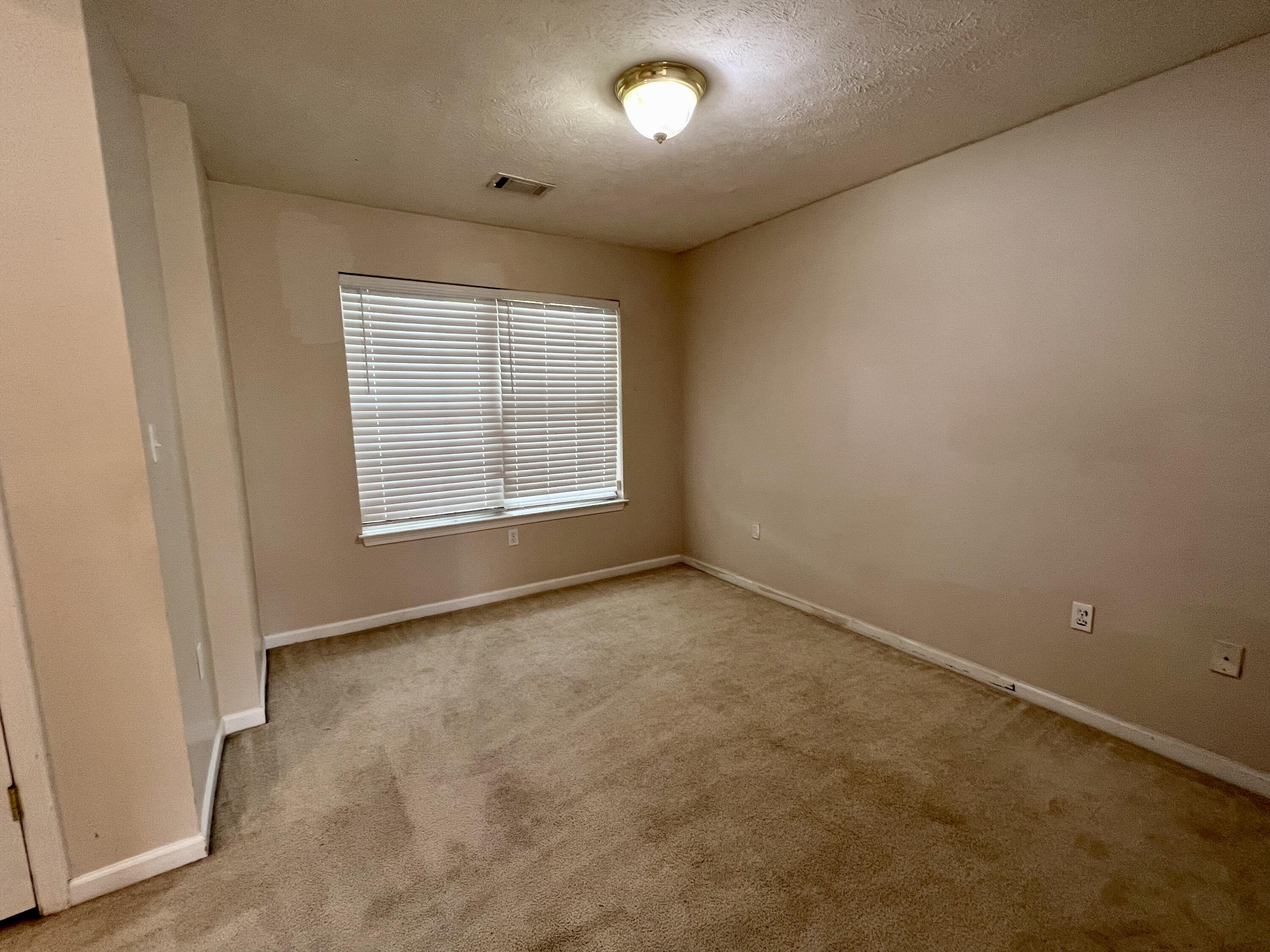308 Crooked Pine Trail Crestview, FL 32539 - Photo 5 of 20 an empty room with a empty space and windows